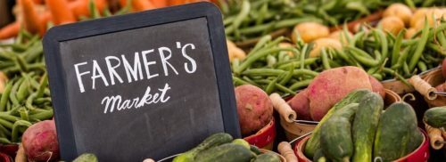 farmer's market sign and produce