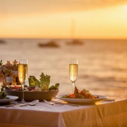 dining table by the water at sunset