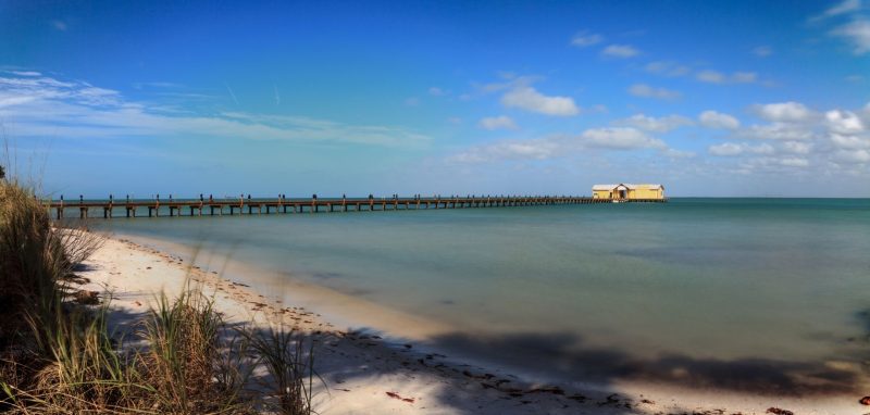 Blue sky over the Anna Maria Island City pier on Anna Maria island, Florida.